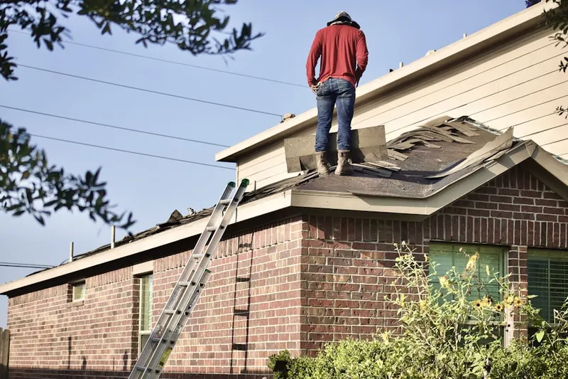 Professional roofer working on a residential roof in Walnut Heights